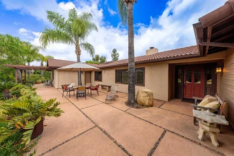 a view of a house with sitting area and furniture