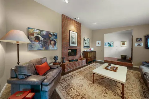 a living room with furniture and a rug