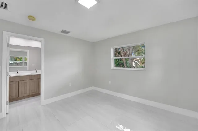 an empty room with a bathroom