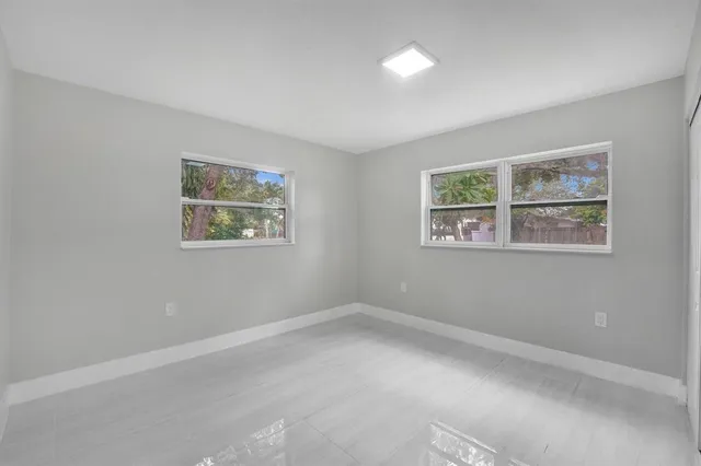 a view of room with window and ceiling fan