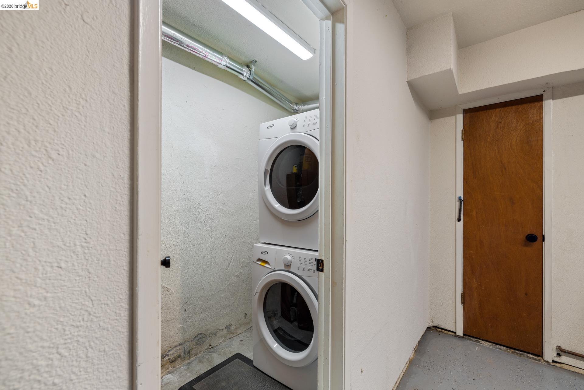 6660 Sobrante Road Oakland, CA 94611 - Photo 41 of 48 Stackable white laundry units within a utility alcove