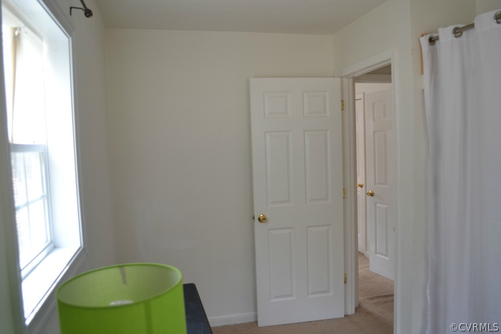 4410 Courthouse Road Midlothian, VA 23112 - Photo 14 of 21 a bathroom with a shower and a mirror