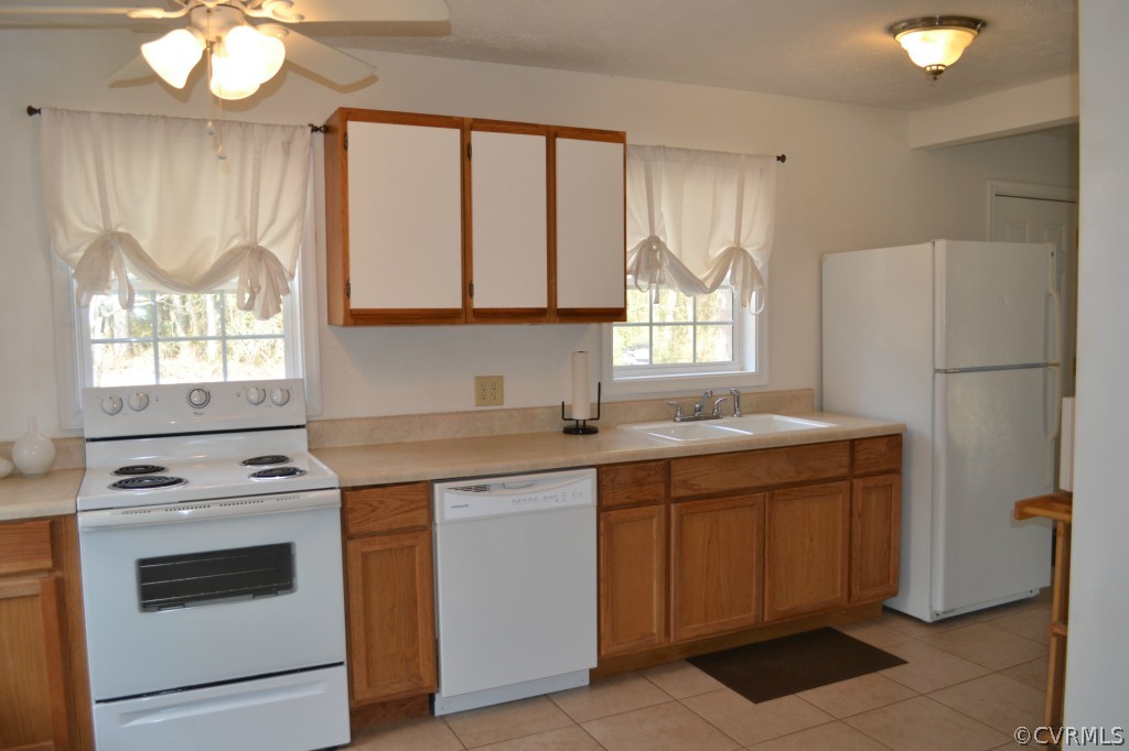 4410 Courthouse Road Midlothian, VA 23112 - Photo 3 of 21 a kitchen with a stove a sink and a refrigerator