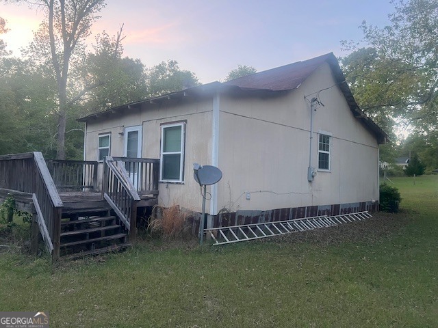 9742 South Sparta Davisboro Road Warthen, GA 31094 - Photo 12 of 39 a view of a house with backyard and deck