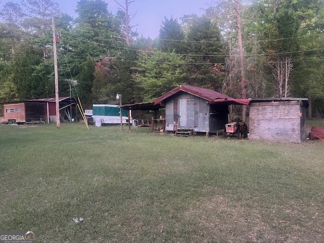 9742 South Sparta Davisboro Road Warthen, GA 31094 - Photo 14 of 39 a view of a house with a yard