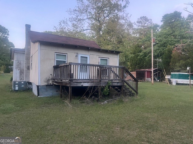 9742 South Sparta Davisboro Road Warthen, GA 31094 - Photo 17 of 39 a view of a house with a yard and sitting area