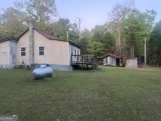 9742 South Sparta Davisboro Road Warthen, GA 31094 - Photo 18 of 39 a view of a house with a yard and sitting area