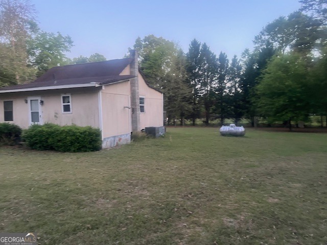 9742 South Sparta Davisboro Road Warthen, GA 31094 - Photo 20 of 39 a view of a house with a yard