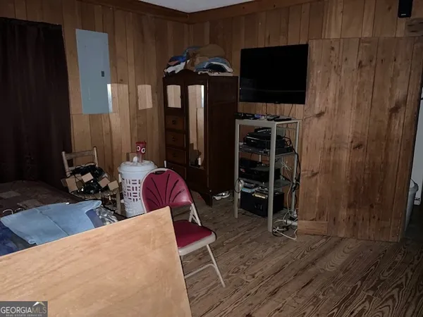 a view of a livingroom with furniture and a flat screen tv