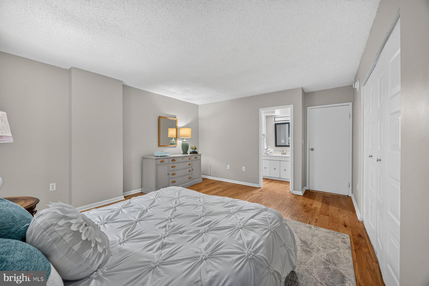 205 East Joppa Road, Unit 302 Towson, MD 21286 - Photo 32 of 52 Serene bedroom with warm wood accents.