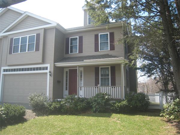 115 Booth Street, Unit 115 Needham, MA 02494 - Photo 1 of 15 a front view of a house with garden