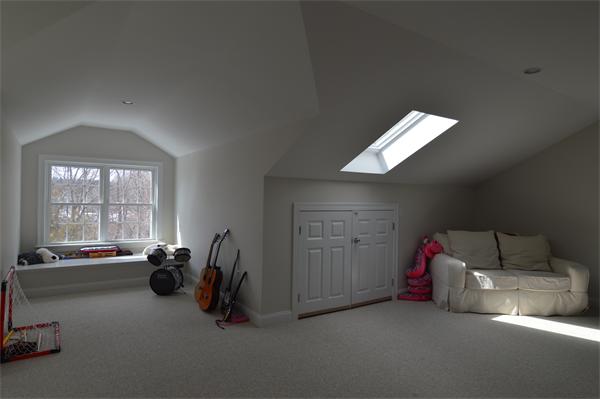 115 Booth Street, Unit 115 Needham, MA 02494 - Photo 13 of 15 a living room with furniture a air conditioner vent and a window