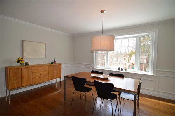 115 Booth Street, Unit 115 Needham, MA 02494 - Photo 3 of 15 a view of a dining room with furniture window and wooden floor