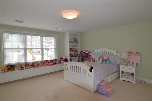 115 Booth Street, Unit 115 Needham, MA 02494 - Photo 7 of 15 a bedroom with furniture and a window