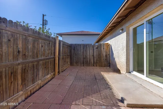 a view of a wooden door with a house