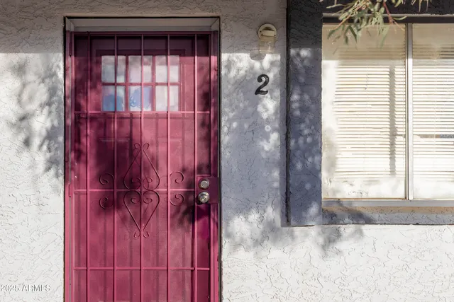 a view of a bathroom with a window and a shower