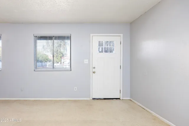 an empty room with windows