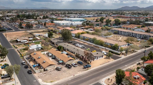 an aerial view of a large building with a city view