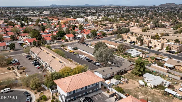 a view of a car park in front of a building