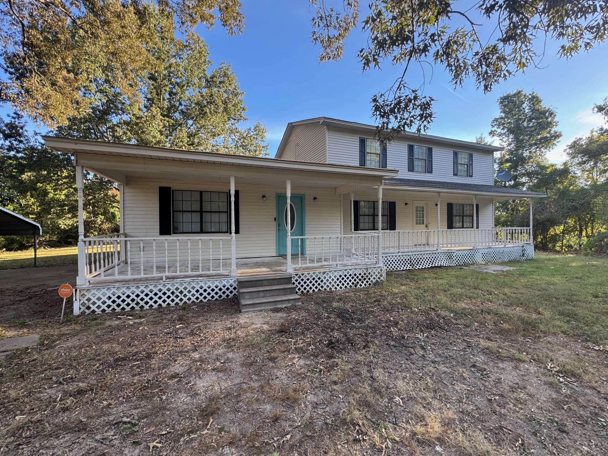 1112 Shoaf Road Covington, TN 38019 - Photo 2 of 17 Farmhouse featuring a large porch