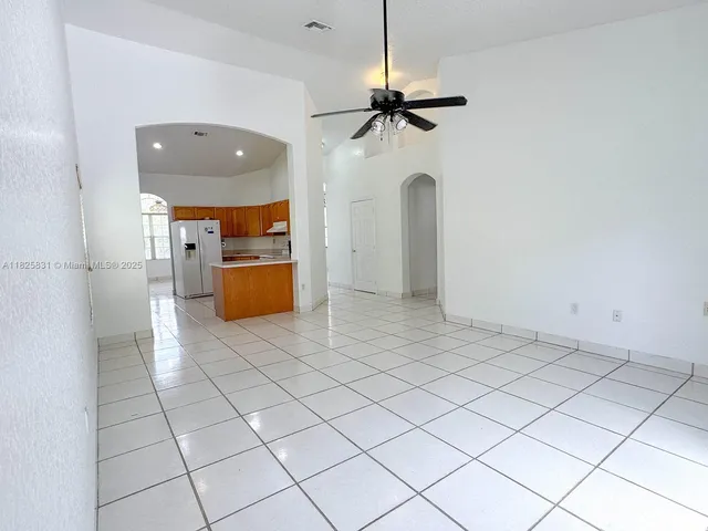 a view of a kitchen with a sink and cabinets