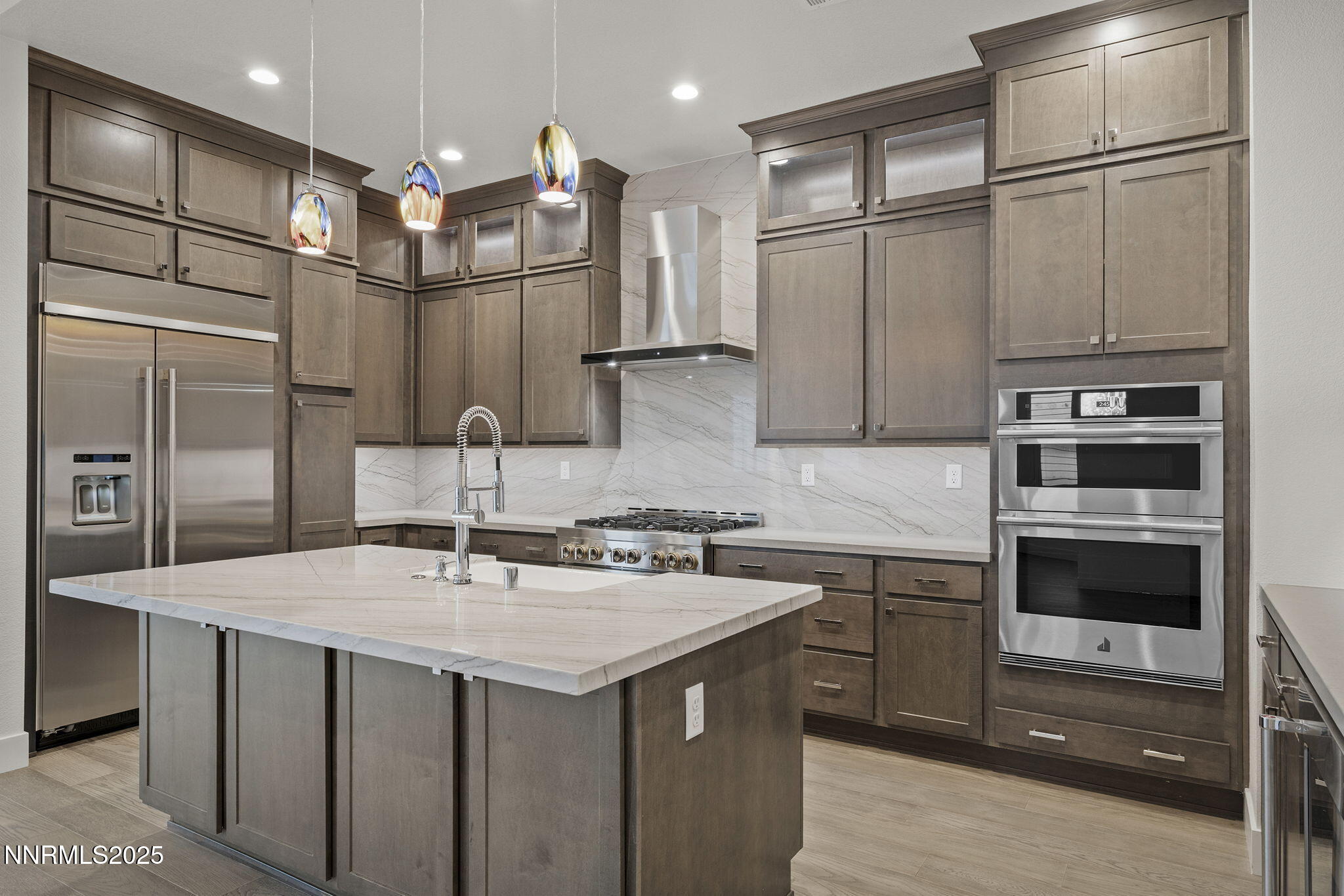 5513 Western Rider Trail Reno, NV 89511 - Photo 11 of 36 a kitchen with stainless steel appliances a sink stove and refrigerator