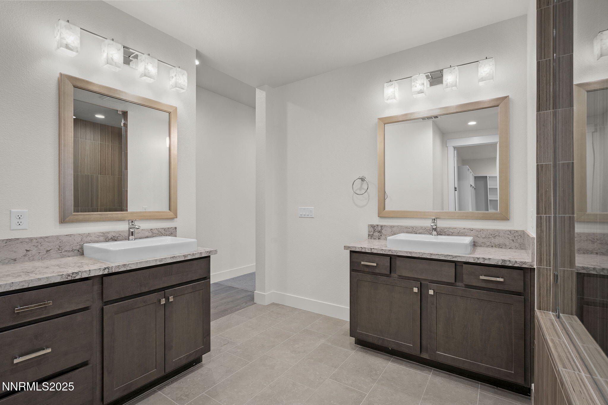 5513 Western Rider Trail Reno, NV 89511 - Photo 14 of 36 a bathroom with double sink and a mirror