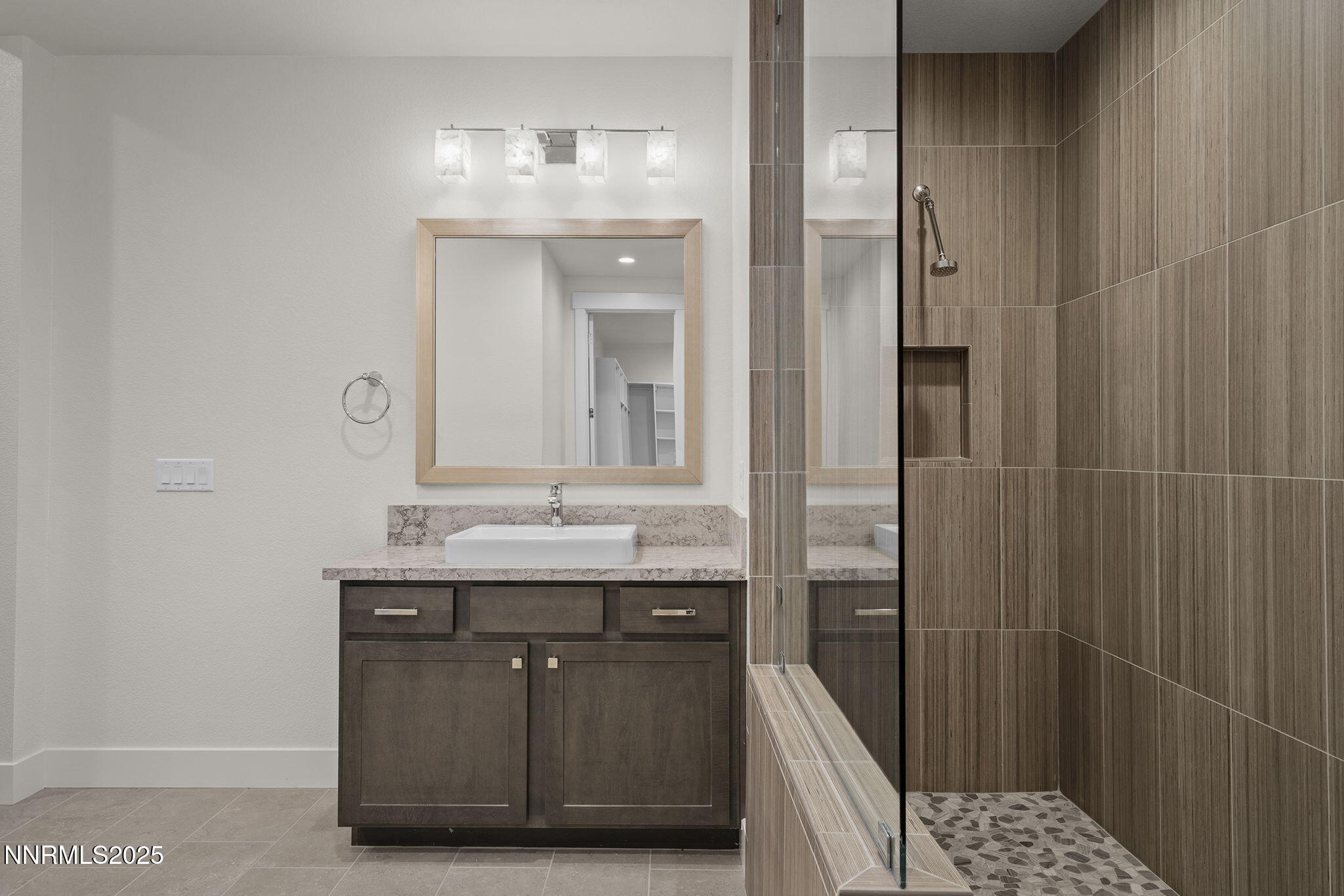 5513 Western Rider Trail Reno, NV 89511 - Photo 15 of 36 a bathroom with a double vanity sink and a mirror