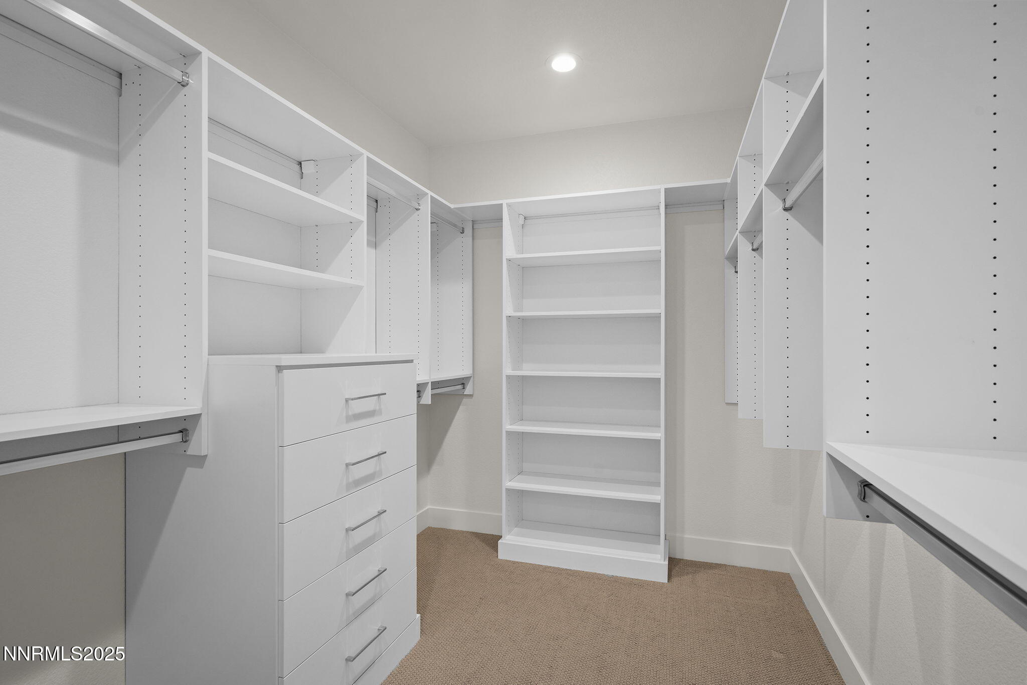 5513 Western Rider Trail Reno, NV 89511 - Photo 16 of 36 a view of walk in closet with empty racks