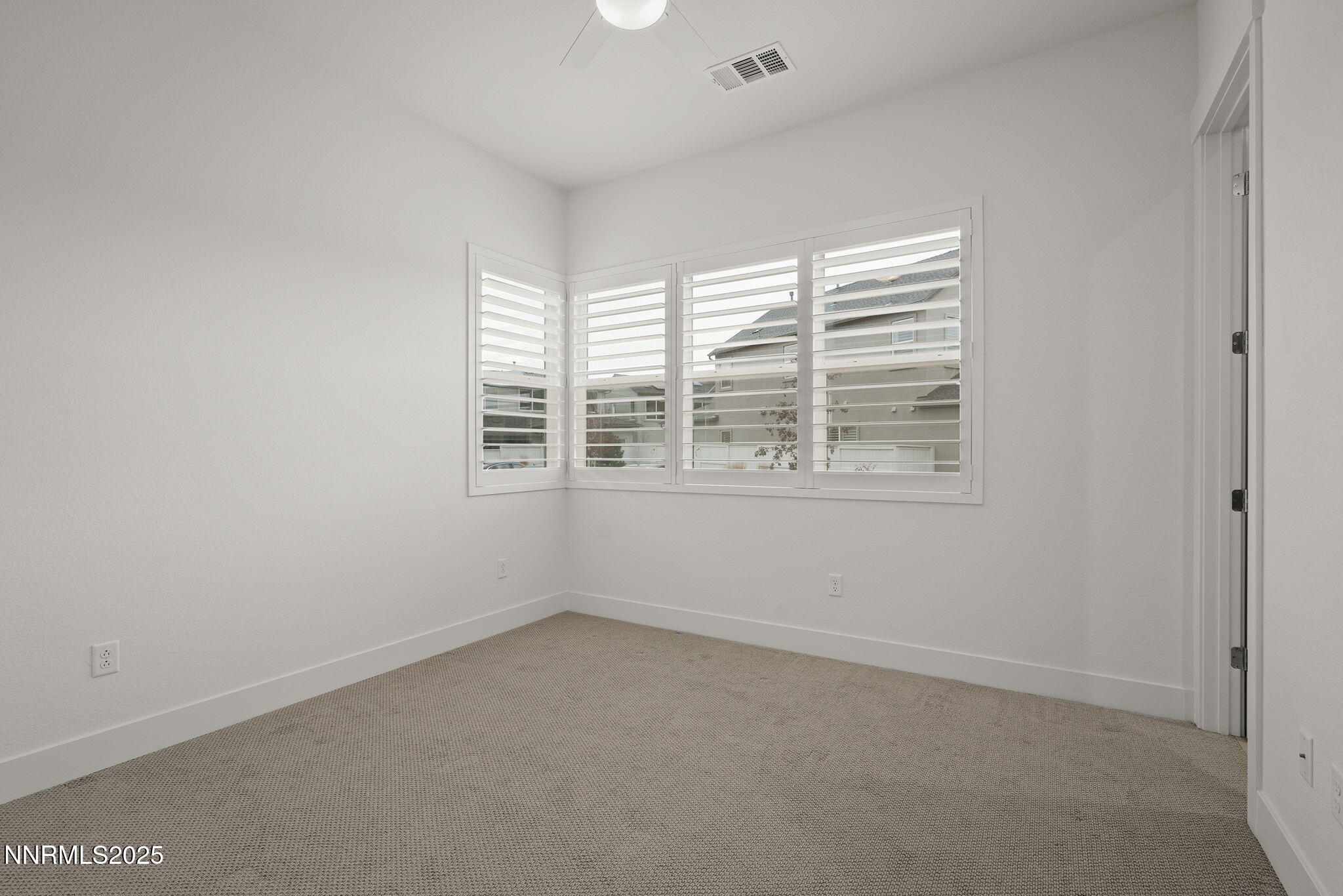 5513 Western Rider Trail Reno, NV 89511 - Photo 17 of 36 a view of an empty room with a window