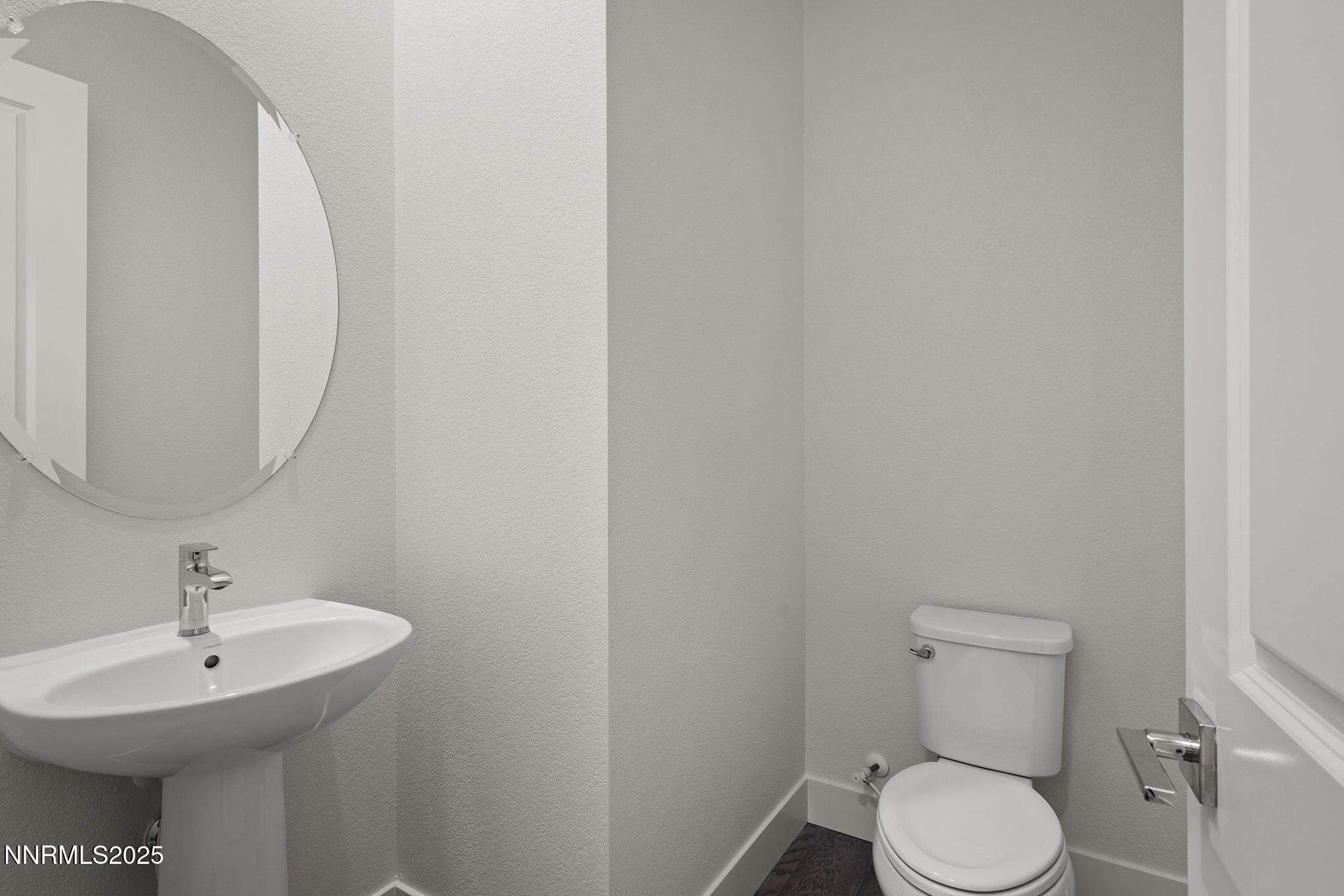 5513 Western Rider Trail Reno, NV 89511 - Photo 20 of 36 a bathroom with a toilet sink and mirror