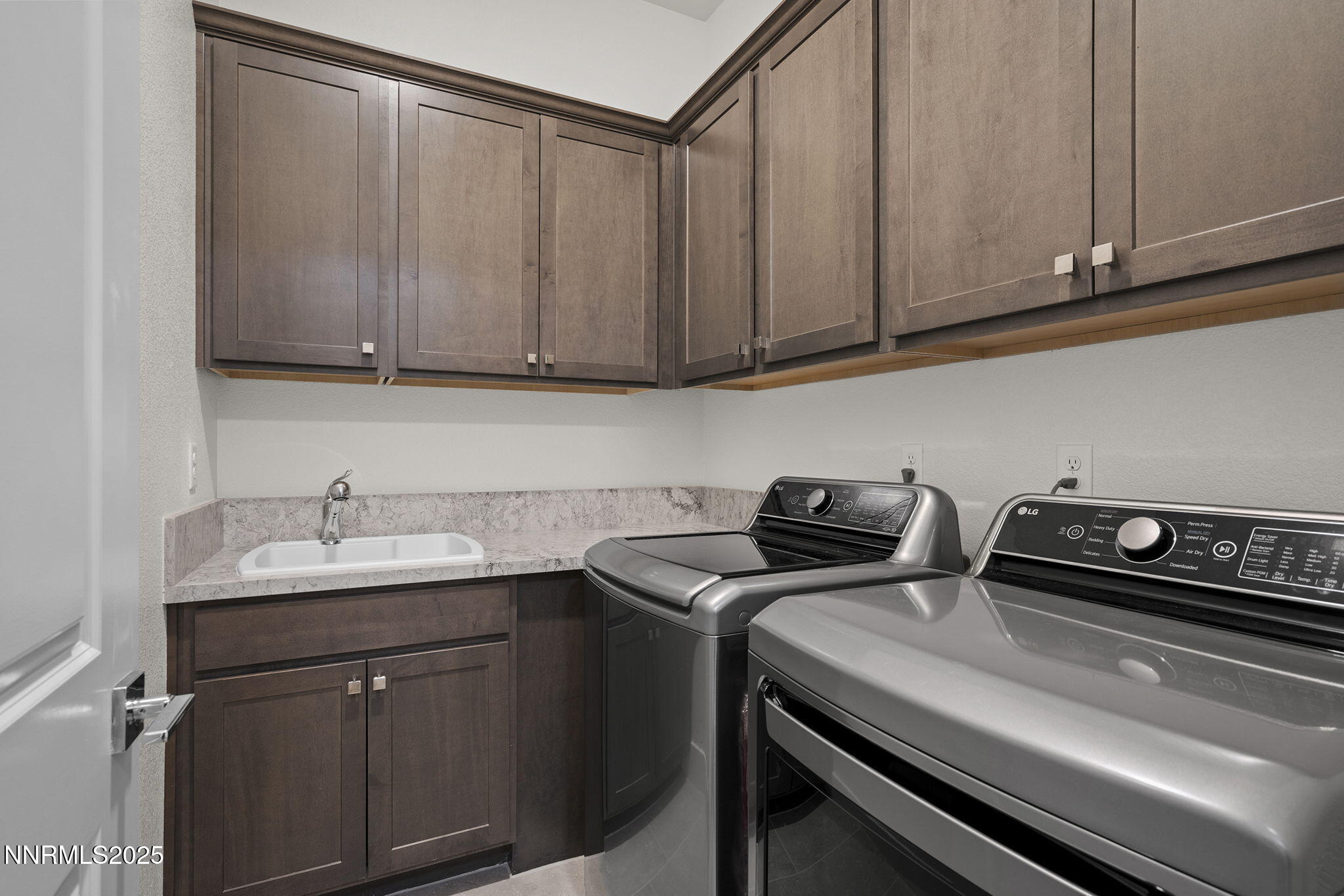 5513 Western Rider Trail Reno, NV 89511 - Photo 21 of 36 a kitchen with a sink and cabinets