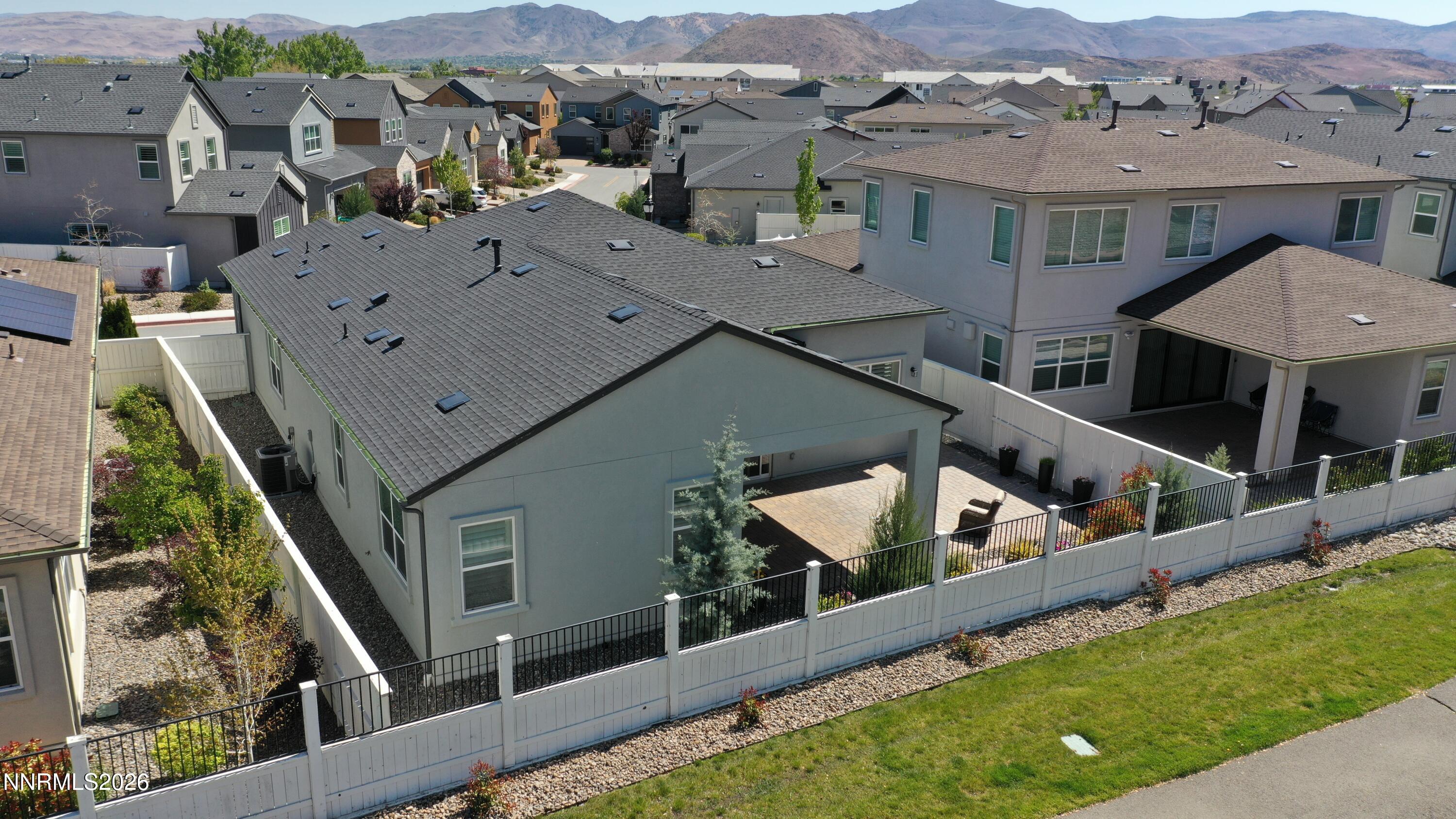 5513 Western Rider Trail Reno, NV 89511 - Photo 26 of 36 an aerial view of multiple houses with a yard
