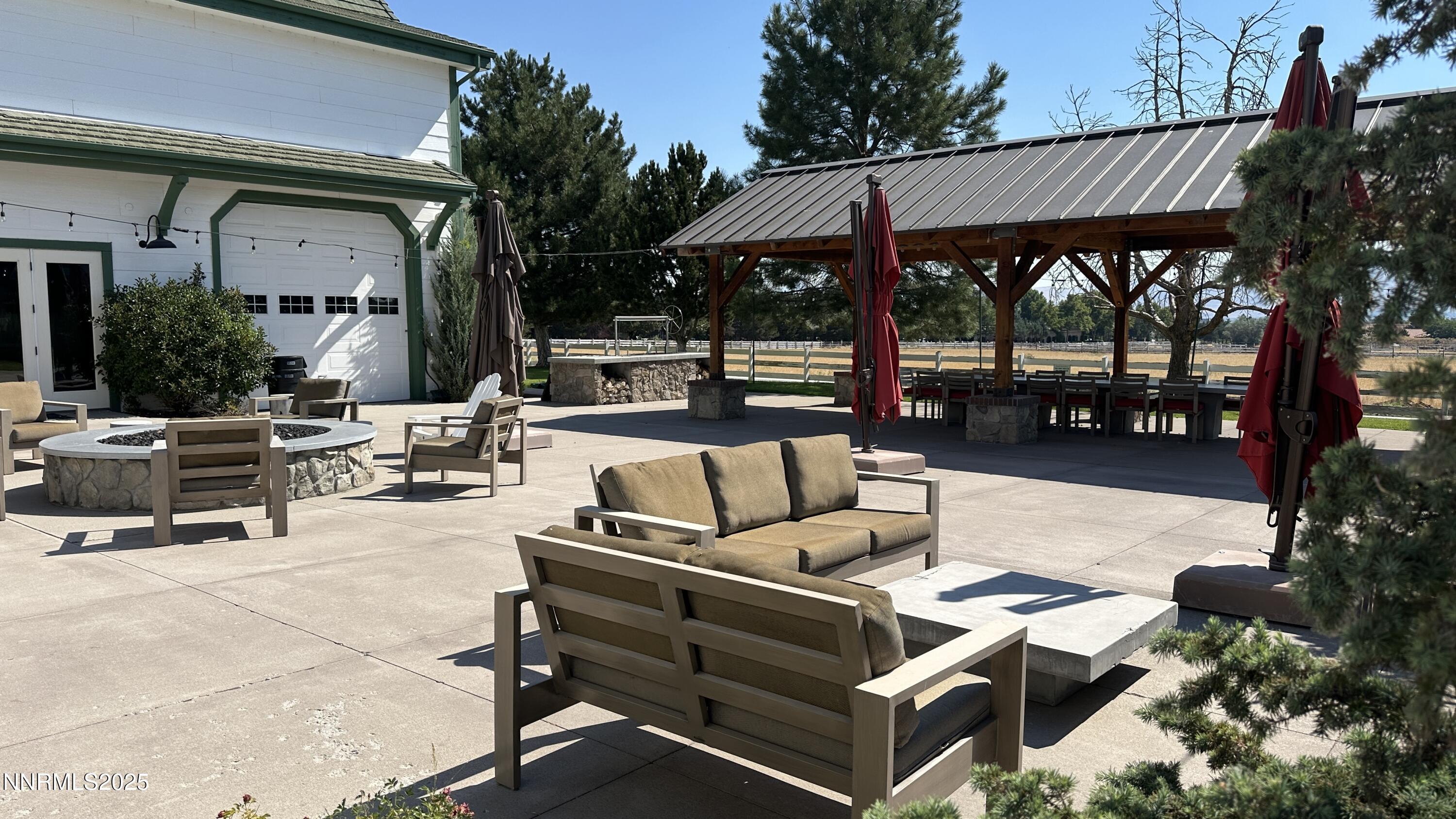 5513 Western Rider Trail Reno, NV 89511 - Photo 29 of 36 a view of a patio with couches table and chairs and potted plants