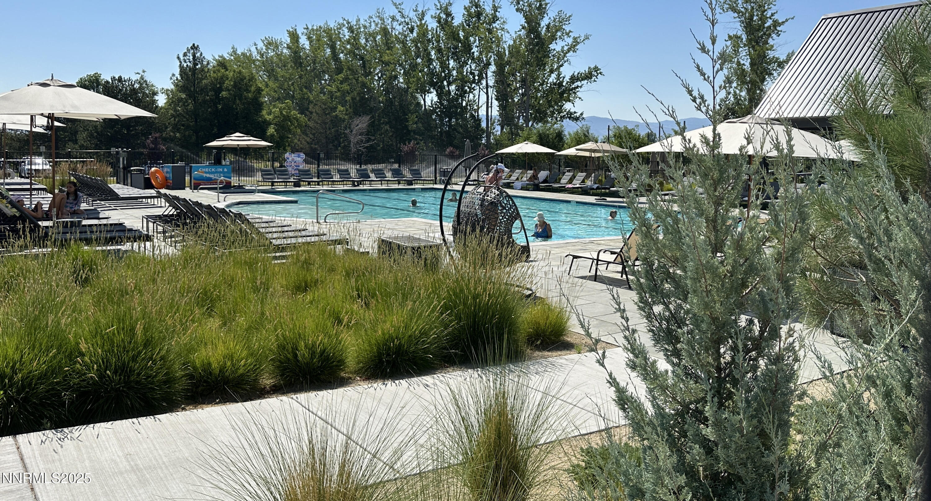5513 Western Rider Trail Reno, NV 89511 - Photo 31 of 36 a swimming pool with outdoor seating and yard