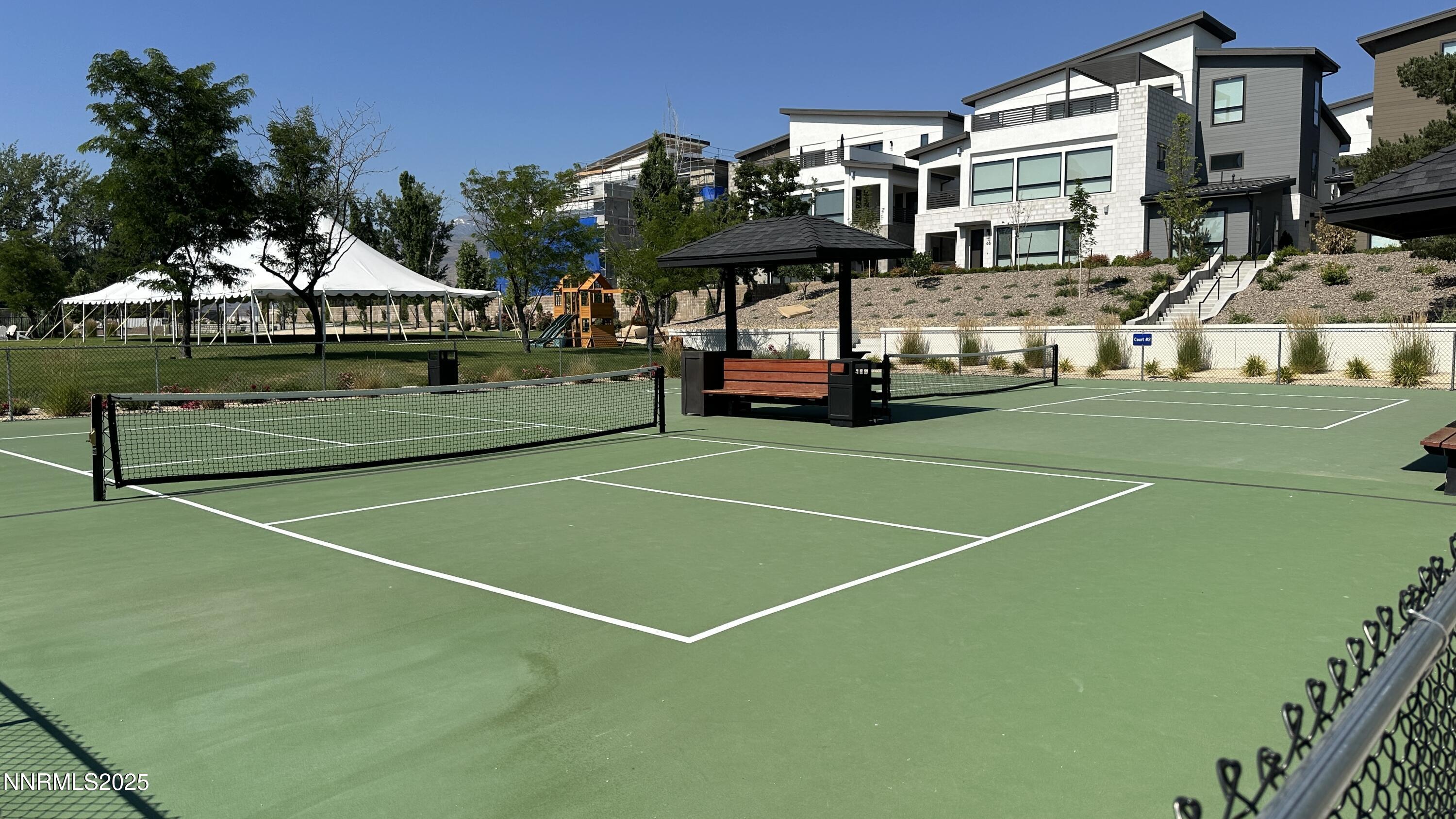 5513 Western Rider Trail Reno, NV 89511 - Photo 34 of 36 a view of a tennis ground with large trees