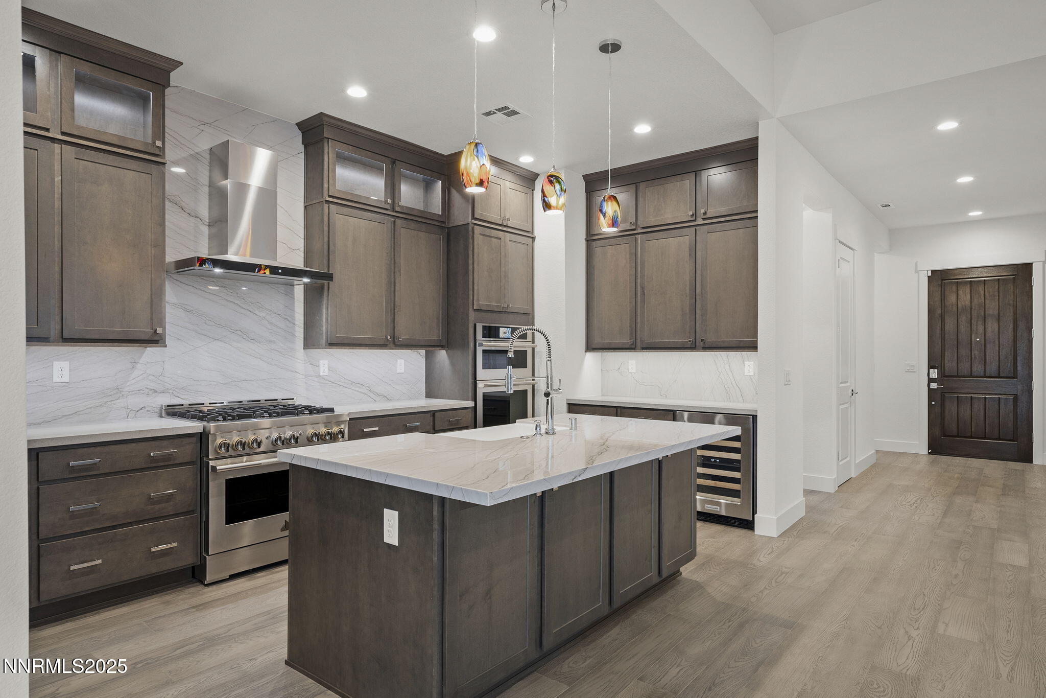 5513 Western Rider Trail Reno, NV 89511 - Photo 9 of 36 a kitchen with a stove a sink and a refrigerator