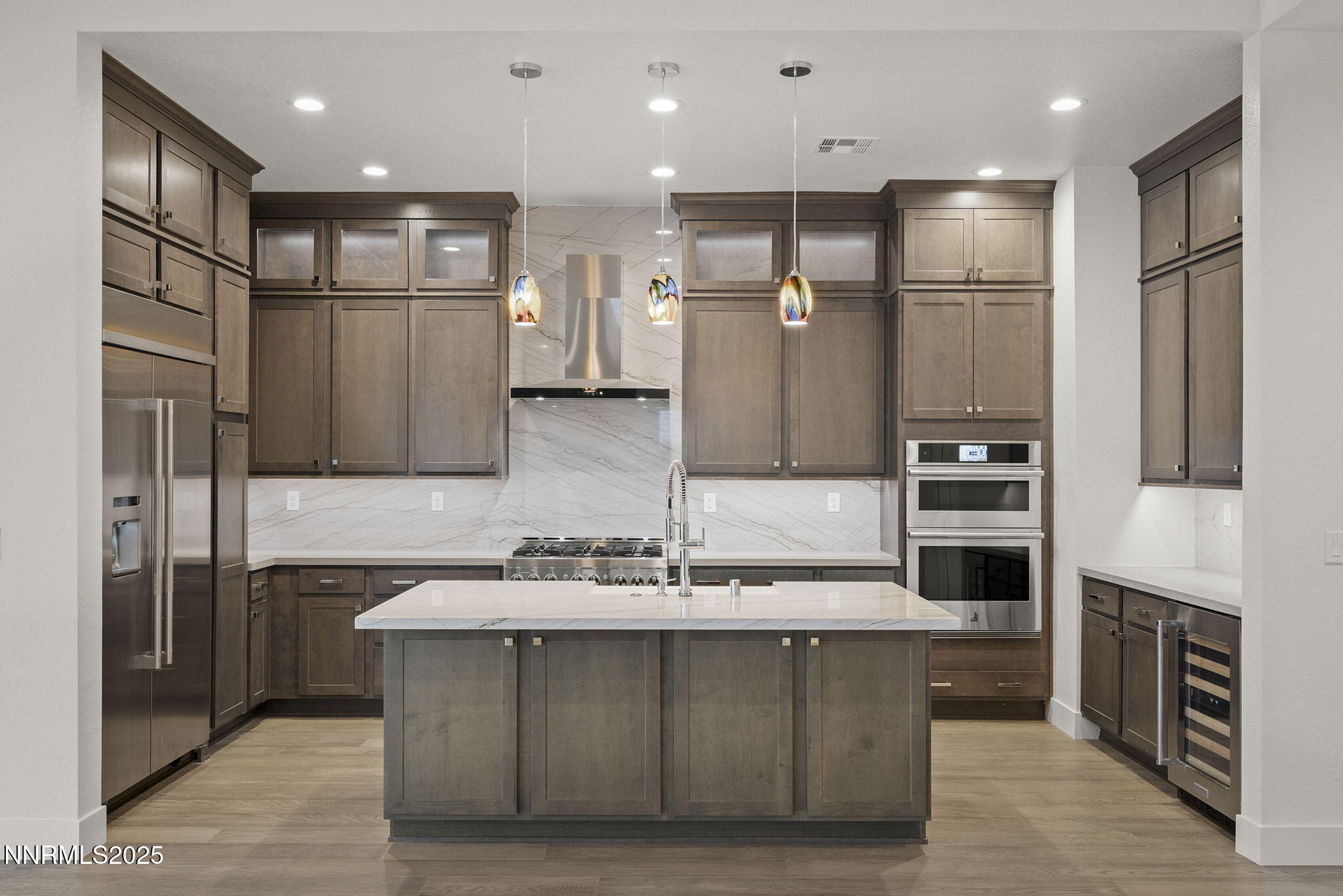 5513 Western Rider Trail Reno, NV 89511 - Photo 10 of 36 a bathroom with stainless steel appliances kitchen island granite countertop a refrigerator and a stove top oven