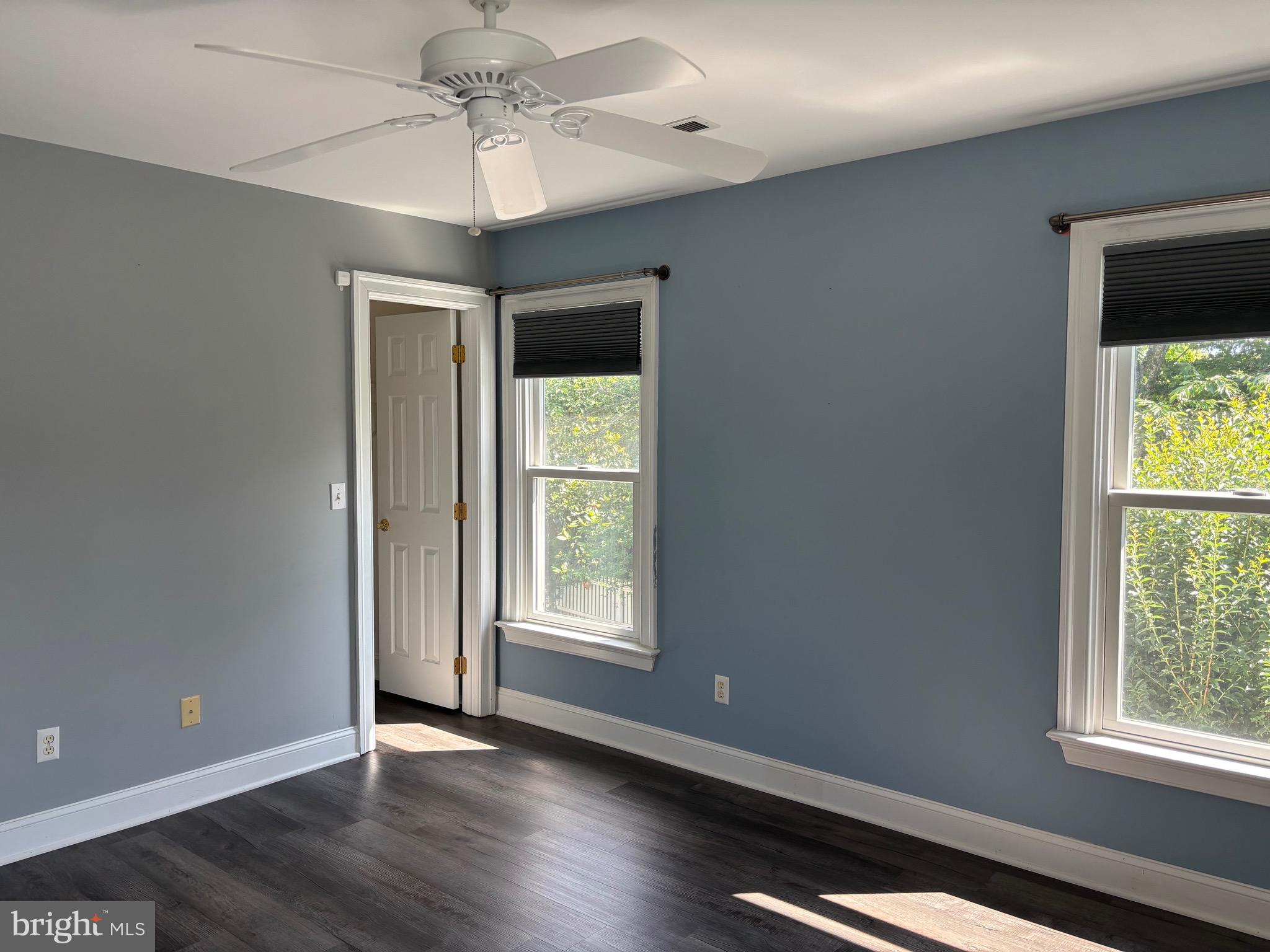 629 Country Club Road Culpeper, VA 22701 - Photo 20 of 27 an empty room with wooden floor chandelier and windows