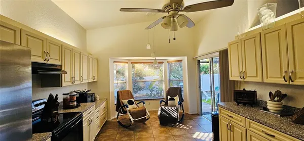 a view of a kitchen with workspace and a window