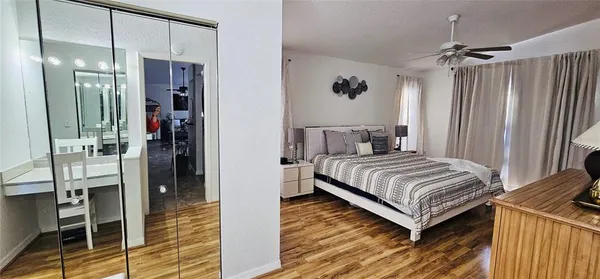 a bedroom with a bed and a mirror