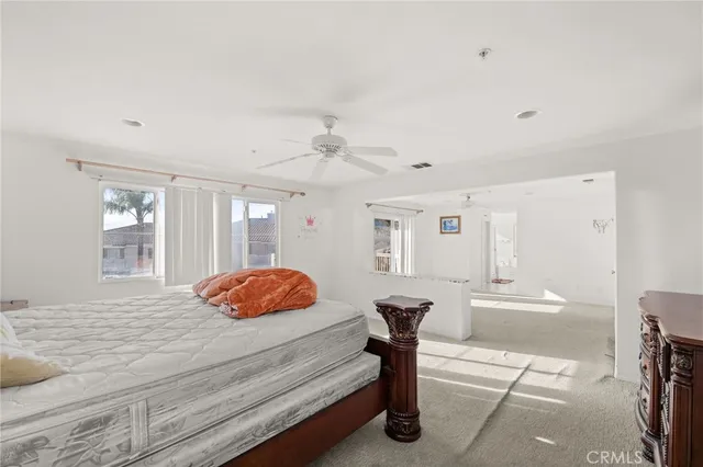 a spacious bathroom with a double vanity sink a mirror and a shower