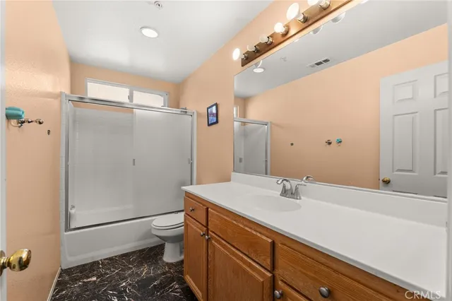 an empty room with a fireplace and painted walls