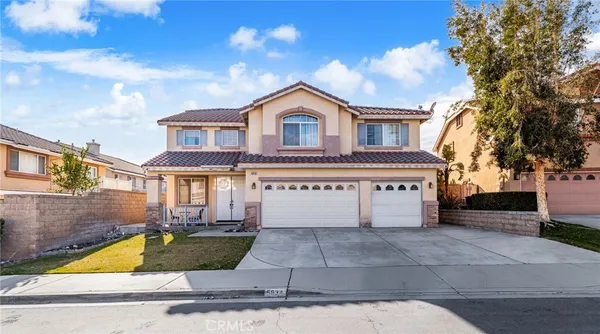 a house view with a garden space
