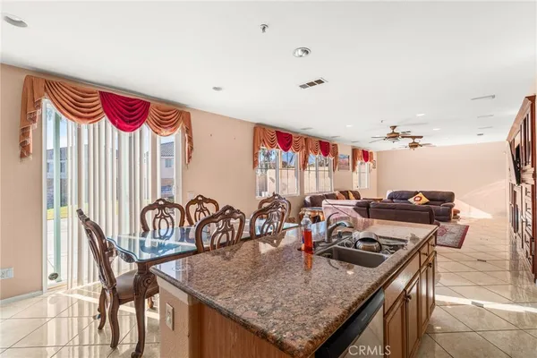 a kitchen that has a table and chairs in it