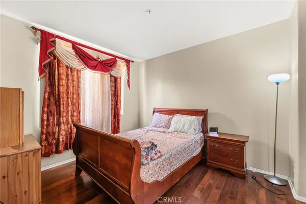 a bed room with a bed and a window