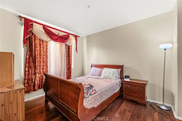 a bed room with a bed and a window