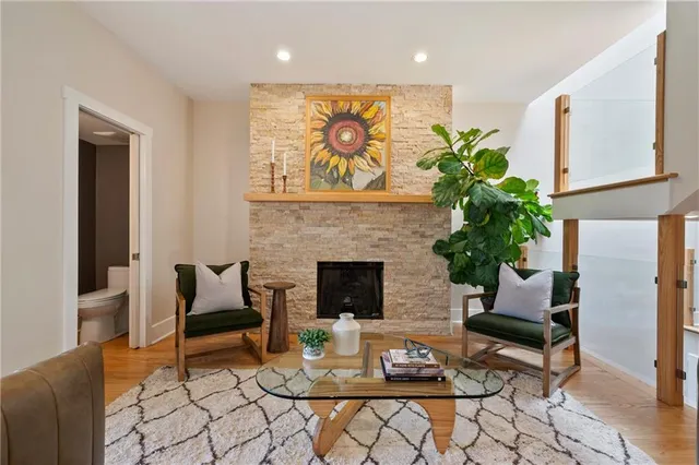 a living room with furniture and a fireplace