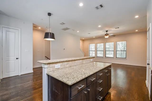 an open kitchen with a sink and window