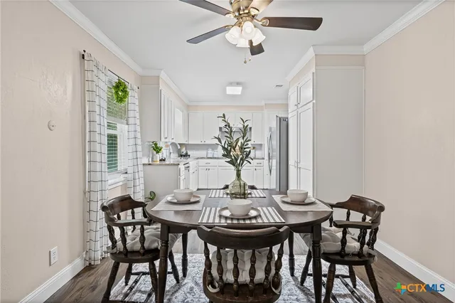 a view of a dining room with furniture and wooden floor